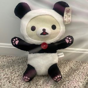 Rilakkuma panda plush with pink paw print
